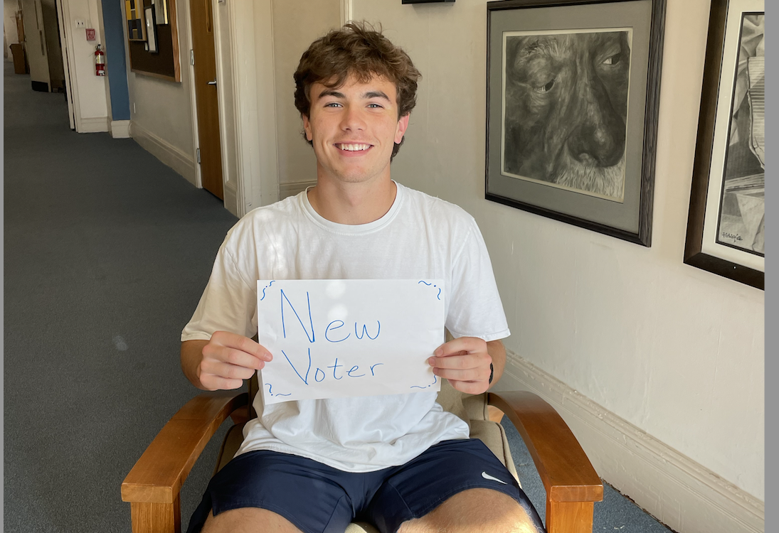 Andrew Blum '25 holding new voters sign 